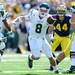 Eastern Michigan quarterback Alex Gillett looks to hand off the ball during the second quarter against Eastern Michigan at Michigan Stadium on Saturday. Melanie Maxwell I AnnArbor.com